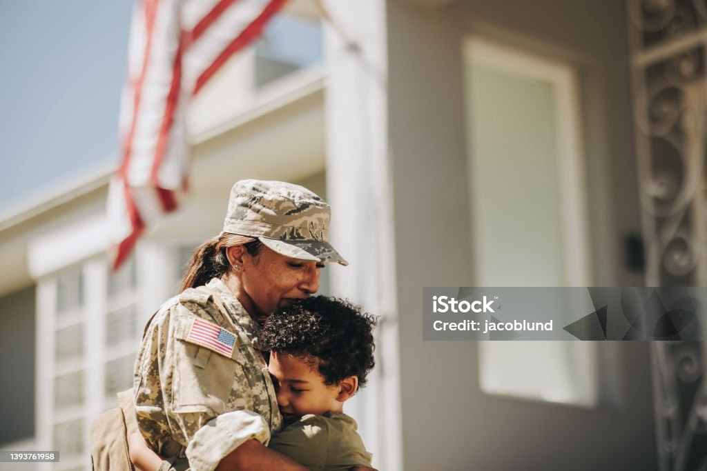 Mother and son reuniting after military deployment